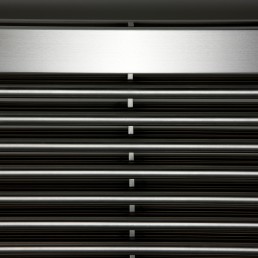 Close-up photo of AEON Sumela radiator in Brushed Matt Stainless Steel finish