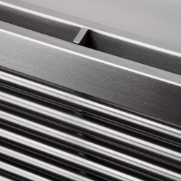 Close-up photo of AEON Sumela radiator in Brushed Matt Stainless Steel finish