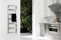 Fatih 5F17 heated towel rail in Brushed Matt Stainless Steel fitted to a modern kitchen wall